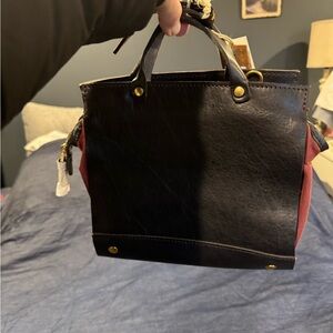 New .. brown leather, maroonish inside. Small, night out on the town purse